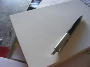 Pen and notepad on a desk