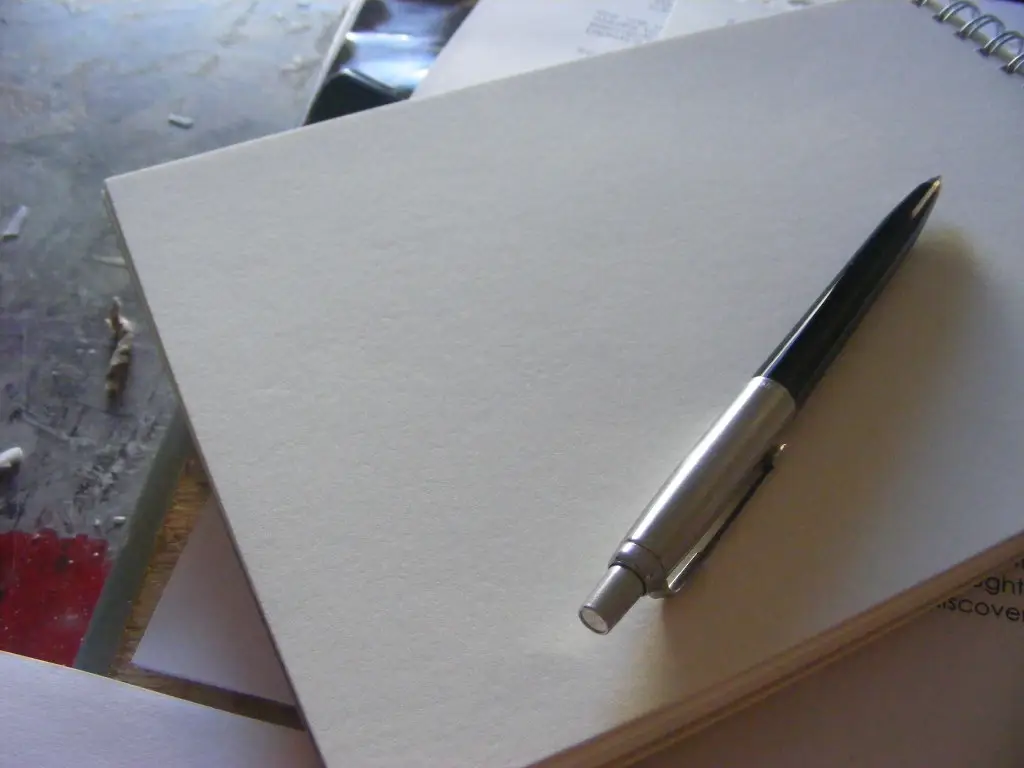 Pen and notepad on a desk